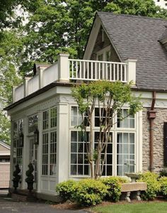 a house with white trim and large windows