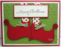 a christmas card with two red boots