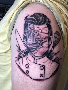 a man's arm with a black and white drawing of a chef on it