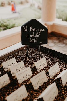 we love you a whole latte sign on top of coffee beans in a box