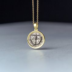 Delphi coin necklace, ancient greek disc pendant. -Oxidized silver set in 9k, 14k or 18k yellow, rose or white gold. -The pendant measures 1.5 cm/0.6 inches. You can buy the pendant with a chain or without a chain. It will be a 9k solid gold chain for the 9k pendant, a 14k solid gold chain for the 14k pendant and a 18k solid gold chain for the 18k pendant. Replica of an ancient coin made of 925 oxidized sterling silver set in solid yellow gold The coin is a replica of the 5th century BC Delphi c Elegant Handmade Coin Necklace, Handmade Elegant Coin Necklace, Sterling Silver Amulet-style Coin Necklace, Amulet Style Yellow Gold Sterling Silver Coin Necklace, Amulet Sterling Silver Coin Necklace In Yellow Gold, Sterling Silver Amulet Coin Necklace, Tarnish Resistant, Ancient Yellow Gold Coin Pendant Jewelry, Antique Gold Sterling Silver Coin Necklace, Ancient Style Medallion Coin Pendant Jewelry