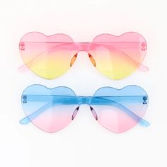 A two pack of cute heart sunglasses in a pink to yellow and turquoise to pink ombré. Adult sized. Playful Heart-shaped Sunglasses With Gradient Lenses, Fun Summer Sunglasses With Heart Print, Trendy Rainbow Sunglasses With Gradient Lenses, Rainbow Sunglasses With Uv Protection For Summer, Multicolor Heart-shaped Sunglasses With Gradient Lenses, Trendy Multicolor Heart-shaped Sunglasses, Cute Heart Shaped Sunglasses For Spring, Cute Heart-shaped Sunglasses For Spring, Heart-shaped Multicolor Sunglasses With Gradient Lenses