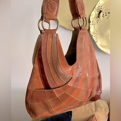 Lucky Brand Groovy 70s Style Rainbow Patchwork Leather Bag High Quality Genuine Cuir Leather Exterior. Brass O-Ring, Embossed Details. Snap Closure. Zipper Inner Pocket. One Convenient Outer Pocket. Retro Cognac Shoulder Bag For Everyday Use, Retro Brown Leather Hobo Bag, Brown Retro Hobo Bag For Everyday Use, Retro Brown Hobo Bag For Shopping, Retro Brown Hobo Bag With Removable Pouch, Vintage Orange Leather Bags, Retro Leather Hobo Tote Bag, Rainbow Patchwork, Leather Scrap