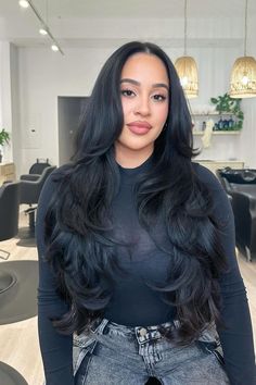 Long layered haircut with voluminous soft waves, showcasing a rich, dark color that adds depth and shine. The gentle middle part frames the face elegantly.  // Photo Credit: Instagram @jem.hair Black Layered Long Hair, Face Framing Middle Part, Middle Hair Layers, Long Layered Haircuts For Long Hair, Long Layers Volume Haircut, Black Haircut Women Long, Lots Of Layers Long Hair Straight, Long Waterfall Layers, Extreme Layers Medium Hair