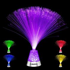 three different colored lights in a vase on a black background, one is purple and the other is green