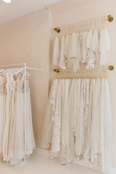 there are many dresses hanging on the rack