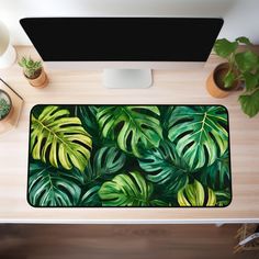 This tropical nature-inspired monstera leaves desk mat is a great choice for enhancing the aesthetic of your workspace. Not only is it practical, ensuring comfort while you work, but it also brings a unique charm and personalizes your work or gaming space. It also makes a wonderful birthday or Christmas gift for coworkers, gamers and crafters. 🌻 PRODUCT DETAILS: Our desk mat features 3mm thick neoprene material, an anti-slip backing which ensures your desk mat won't slide while in use and hemme Tropical Desk, Desk Decor Aesthetic, Plant Desk, Nature Desk, Cute Office Decor, Gaming Space, Tropical Nature, Aesthetic Desk, Christmas Gifts For Coworkers