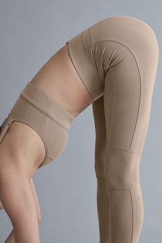 A subtle nod to the ’80s, these leggings have coolly contrasting ribbed panels and bikini bottom seaming. We love the high-rise, full-length fit and the stretchy elastic waistband with a tonal Alo logo. And they’re done in Alosoft—our coziest fabric with a buttery feel and a brushed finish. Complete the look with the matching Alosoft Head Start Bra. Functional Compressive Alo Yoga Bottoms, Alo Yoga Compressive Functional Bottoms, High Stretch Legwear For Workout, High Stretch Workout Legwear, Beige Compression Bottoms With Seamless Construction, Beige Compression Bottoms For Yoga, Beige Compression Yoga Bottoms, Compressive Beige Yoga Bottoms, Compressive Bottoms With Ribbed Waistband For Pilates