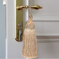 a door handle with a tassel hanging from it