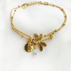 "The subtle Dainty layering dragonfly  bracelet is truly beautiful-  intricately detailed  so sweet jewelry. May be worn on its own, or styled with the other. This is \"double face\" charm-same for both side , no worry on the pendant twist ! Matching jewelry available :)  https://www.etsy.com/shop/AnemonAtelier?ref=seller-platform-mcnav&search_query=dragonfly ♡ DETAILS  Pendant : 0.66\" x 0.78\" (17 mm x 2 cm) Material:  24 k gold plated over 925 sterling silver  Lenght: 6.29\" - 16 cm plus exte Elegant Adjustable Dragonfly Jewelry, Adjustable Gold Dragonfly Jewelry, Adjustable Gold Charm Bracelet With Delicate Chain, Delicate Adjustable Yellow Gold Charm Bracelet, Adjustable Gold Jewelry With Butterfly Charm, Delicate Adjustable Gold Charm Bracelet, Delicate Gold Charm Bracelet With Adjustable Chain, Dainty Gold-tone Charm Bracelet Gift, Adjustable Delicate Butterfly Charm Jewelry