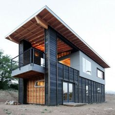 a small house made out of shipping containers