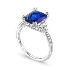 This beautifully crafted engagement ring will thrill whoever receives it! With a Deep blue center stone and gorgeous white stones on either side set in polished sterling silver, it is both modern and classic! Sleek and stylish, this ring will add flair to any outfit without being overly elegant, and can be easily paired with formal wear. This ring is the perfect gift for yourself or a loved one!Carat Weight: 3.41 ctStone Size: 8*10 mmStone Type: Jeulia® StoneNumber of Stones: 1 Stone Color: Sapphire BlueStone Shape: RadiantCarat Weight: 0.246 ctStone Size: 2 mmStone Type: Jeulia® StoneNumber of Stones: 6 Stone Color: Diamond WhiteStone Shape: RoundWeight: 2.3 gWidth: 1.1 mmHeight: 6.7 mmThickness: 1.2 mmMaterial: 925 SilverPlating Color: Silver Elegant Sapphire Crystal Ring With Diamond, Elegant Sapphire Crystal Diamond Ring, Formal Sapphire Crystal Ring With Center Stone, Elegant Sapphire Crystal Ring For Formal Occasions, Elegant Radiant Cut Birthstone Ring For Wedding, Elegant Radiant Cut Birthstone Wedding Ring, Classic Sapphire Crystal Ring For Formal Occasions, Elegant Sapphire Ring With Center Stone For Promise, Elegant Sapphire Diamond Ring For Promise