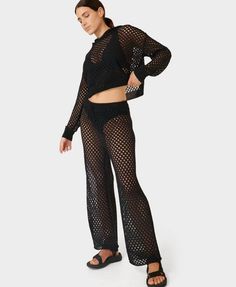 Our new summer trousers designed to be worn over swimwear. Made from a cotton-blend crochet knit. High-rise waist with a wide leg silhouette . Adjustable drawcord at waist. Pair with our matching Beachside Crochet Hoody. Inseam length: 72cm / 28". Model wears size S and is 178cm/5'10" tall.. Style Code: SB9767Colour: Black Crochet Pant, Crochet Pants, Womens Black Pants, Summer Trousers, Activewear For Women, Trouser Design, Sweaty Betty, Printed Leggings, Bottoms Pants