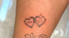 two hearts with the word love tattooed on each side of their legs, and an image of a dog's head behind them