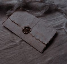 a piece of cloth with a waxed seal on it