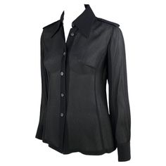 Presenting a collared button-up sheer Gucci top designed by Tom Ford. This top has long sleeves, a prominent collar, and epaulets. Not your average top, this shirt was designed for the Spring/Summer 1996 collection and is the perfect chic elevation to the standard collared shirt. Approximate measurements: Size - IT38 Shoulder to hem: 24.5" Bust: 32" Waist: 30" Shoulder to cuff: 23" Underarm to cuff: 16" Luxury Fitted Gucci Blouse, Gucci Luxury Button-up Tops, Gucci Evening Long Sleeve Tops, Gucci Spring Button-up Shirt, Formal Gucci Button-up Tops, Gucci By Tom Ford, Dior By John Galliano, Dior Clothing, Gucci Top