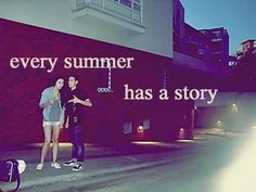 two people standing in front of a building with a sign on it that says every summer has a story