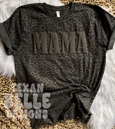 *Please read full description Black Leopard Mama Shirt, Black On Black, Puff Print, Puffy Letters, Popular, Graphic Tee, Viral, Mama Shirt, Mom Shirt, Gift You will receive: 1 - Unisex sized shirt with the above design    About this item: -This design is a puff vinyl transfer  -Machine washable, turn garment inside out, cold water -If you have any questions feel free to message me! Mama Shirts Sublimation, Leopard Mama Shirt, Puffed Vinyl Shirt, Mama Tshirt Design, Black On Black Puff Vinyl, Mama T Shirt Ideas, Black Puff Vinyl On Black Shirt, Puffy Vinyl Shirt, Puff Vinyl Designs