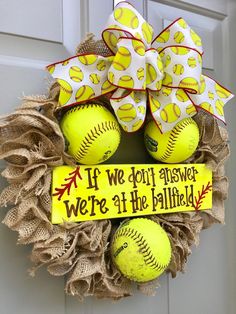 a wreath that has softballs on it with a ribbon around the front door and saying if we don't answer, we're at the ballfield