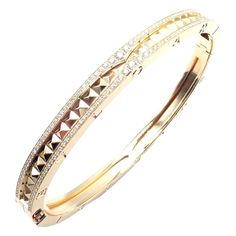 Authentic! Bulgari Bvlgari B.Zero1 Rock 18k Yellow Gold Diamond Bangle Bracelet Welcome to Fortrove Payment / Shipping / Returns STORE HOME About Us NEW ARRIVALS ENDING SOON Add to Favorites FEEDBACK Contact Us Authentic! Bulgari Bvlgari B.Zero1 Rock 18k Yellow Gold Diamond Bangle Bracelet Product Description About This Piece: The Bulgari B.Zero1 Rock 18k Yellow Gold Diamond Bangle Bracelet exudes luxury and elegance. Featuring a bold design, it's crafted from 18k yellow gold and adorned with brilliant diamonds.  This iconic piece combines contemporary flair with classic sophistication, making it a statement accessory for any occasion. Retail Price of this bracelet is $20,900 Metal: 18k Yellow Gold Width:  Weight: 6mm 34.1 grams Size: Medium 6.7" or 17cm Stones: 320 brilliant cut diamonds Trinity Bracelet, Chanel Ring, Diamond Bangle Bracelet, Hermes Jewelry, Indian Jewellery Design Earrings, Diamond Bangles Bracelet, Jewelry Design Earrings, Fine Jewelry Bracelets, Gold Bangle