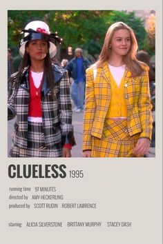 two women in plaid jackets and hats walking down the street