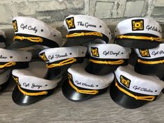 many hats are stacked on top of each other in the shape of an officer's cap