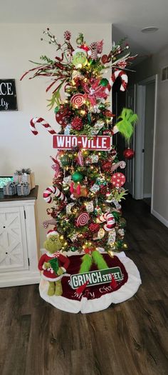 a christmas tree decorated with candy canes and ornaments