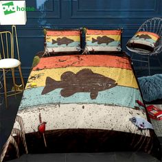 a bed with a fish on it in front of a blue wall