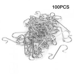 a pile of metal clothes pins on top of a white background with the words 100 pcs