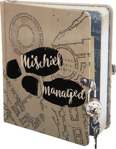 an open book with writing on it and a key hanging from the front cover that says mishik managed