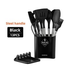 the black kitchen utensils are in a holder