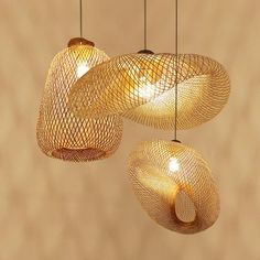 three hanging lights made out of woven material