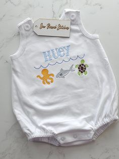 Personalized boy bubble  Our unisex bubble is perfect for the hot summer days and vacation to the beach!  Super soft with snaps at the bottom for easy diaper change and buttons at the shoulders.  Machine wash inside out. Tumble dry low.  Please leave clear instructions with name or initials, font and thread color.  By submitting your order, you agree that everything entered in the personalization box is correct, including name spelling. Due to the personalization, custom orders cannot be cancele Blue Summer Bubble Romper For The Beach, Blue Summer Bubble Romper For Beach, Playful White Diaper Cover For Summer, Casual White Diaper Cover For Summer, Fun Summer Beach Bubble Romper, Cute Summer Beach Diaper Cover, White Summer Bubble Romper For Beach, Cute White Diaper Cover For Summer, Cotton Diaper Cover For Beach And Summer