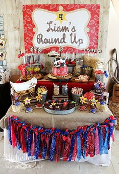 an image of a table set up for a party with food and decorations on it