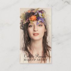 a woman with flowers in her hair is shown on the cover of a magazine or brochure