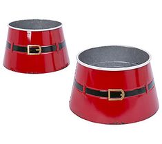 two red tin canisters with santa's belt around the top and bottom