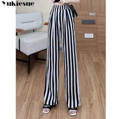 Shipping: Worldwide Express Shipping AvailableDelivery time: 7-15Days Fast ShippingReturns: Fast refund, 100% Money Back Guarantee.Brand Name: YUKIESUEStyle: CasualAge: 25-34Origin: Mainland ChinaCN: GuangdongWaist Type: HIGHElasticity: Slight StrechFabric Type: BroadclothPattern Type: stripedPant Style: Wide Leg PantsMaterial: PolyesterFit Type: RegularLength: Full LengthSeason: Spring/SummerPlace Of Origin: China (Mainland)Closure Type: Elastic WaistGender: WOMENModel Number: 2227Front Style: Black High-waisted Bottoms With Vertical Stripes, High Waist White Pants With Vertical Stripes, White High Waist Bottoms With Vertical Stripes, High Waist White Bottoms With Vertical Stripes, Trendy Black Bottoms With Vertical Stripes, White Vertical Stripes Pants, Trendy White Striped Pants, Black Pants With Vertical Stripes For Summer, Trendy White Pants With Vertical Stripes