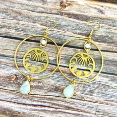 sun hoop earrings Adjustable Brass Jewelry With Sun Design, Adjustable Brass Sun Design Jewelry, Brass Dangle Jewelry With Sun Design, Gold Hoop Jewelry With Moon Phase Detail, Brass Sun Design Dangle Jewelry, Brass Sun Design Drop Earrings, Bohemian Gold Hoop Earrings With Moon Charm, Gold Round Earrings With Sun And Moon Design, Statement Hoop Earrings