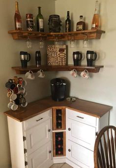 a corner cabinet with wine glasses on it