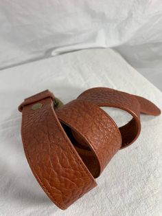 "You are looking at a genuine leather belt by Leatherock USA. Belt is size medium to large and measures 38\" long, 1\"2 wide, with 28\" 4 from the first perforation and 32\"4 at it's last perforation. Buckle measures 3\"1 wide X 2\"2 at it's highest. There are a few light scuffs with no tears. The condition of this belt is good with great detail, brass tone hardware with several stones and rhinestones. 100% genuine Leatherock made in USA. I want to stress that item is vintage which means it's no Bell Gardens, Tan Leather Belt, Genuine Leather Belt, Shopping Tote Bag, Light Beige, Black And Tan, Tan Leather, Leather Belt, Fossil