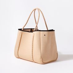 The cool, everyday bag that’s perfect for work, gym, beach, traveling, and everything in between. Chic Sand-colored Beach Bag For Everyday Use, Chic Sand Shoulder Bag For Travel, Sporty Summer Weekend Bag, Beige Tote Beach Bag For Weekend, Casual Beige Weekender Bag With Double Handle, Chic Tote Bag For Weekend, Chic Weekend Tote Bag, Large Capacity Summer Shoulder Bag For Weekend, Summer Shoulder Bag With Large Capacity For Weekend