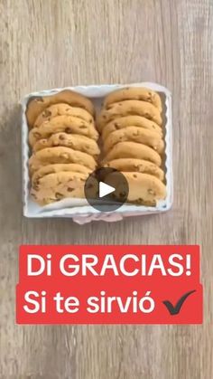 a box filled with cookies sitting on top of a wooden table