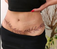 a woman's stomach with leaves on it