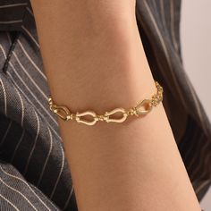 Handcrafted with care, this exquisite piece features a delicate horseshoe charm that exudes timeless charm and grace. The high-quality solid gold chain adds a touch of luxury, making it a perfect accessory for everyday wear or special occasions. Choose from rose gold, white gold, or classic yellow gold in 14 karat options to complement your personal style. This stunning bracelet makes for a thoughtful and meaningful gift for yourself or someone special, symbolizing good fortune and a stylish sta Classic Metal Bracelets With Charms, Elegant Link Charm Bracelet, Luxury Gold Horseshoe-shaped Jewelry, Luxury Gold Horseshoe Jewelry, Classic Formal Bracelets With Charms, Classic Charms Bracelet For Formal Occasions, Charm Link Chain Bracelet, Elegant Adjustable Charm Bracelets, Elegant Gold Horseshoe Jewelry