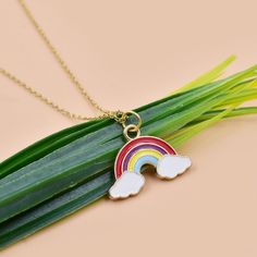 14K Yellow Gold Plated Rainbow Charm Necklace, Designer Enamel Rainbow Charm, Rainbow & Cloud Enamel Charm, Wholesale Rainbow Charm Necklace ✔ Handmade ✔ Metal: 925 Silver ✔ Color: Yellow Gold Plated  ✔ Chain Size: 16 Inch  ✔ Size: 20x23 mm ✔ Stone Name: No Available 14K Gold, 9k Gold, and 925 Sterling silver. Worldwide shipping is now available 4 to 5 business days 🛠 All pieces are handcrafted to order, please allow up to 1-2 weeks for the item to ship. Need it sooner? Just ask and we will let Rainbow Enamel Jewelry As Gift, Enamel Charms Pendant Necklace, Rainbow Enamel Jewelry For Gift, Multicolor Enamel Charm Necklaces As Gifts, Rainbow Enamel Jewelry For Gifts, Rainbow Enamel Jewelry Gift, Rainbow Necklace With Heart Charm As Gift, Rainbow Metal Necklace, Playful Rainbow Charm Necklace For Gift