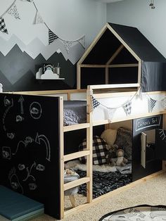 a child's bedroom with a black and white theme