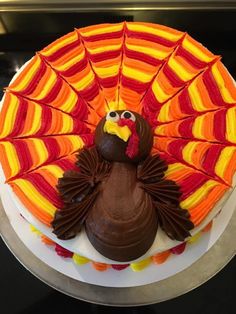 a decorated cake with a turkey on top