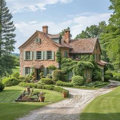 a large brick house surrounded by lush green trees