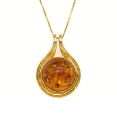 Gold Amber Pendant set with a Natural Amber in a top grade & natural color, at 18mm size (20 Cts) from the Baltic Sea. Gold Vermeil: 18k Gold over Solid 925 Sterling Silver ☞ made to last. Matching Ring & Matching Earrings - please ask me Details:• Natural Amber sourced from Russia• Amber: 18mm, 20 Ct, cabochon cut• Pendant Height 32mm, Width 22mm• Free Complimentary Chain• 18k Gold Vermeil❀ Each Natural Gem is unique & will have Slight variations from the product pictures "no two Natural Stones Ring Matching, Mother Rings, Amber Pendant, Matching Ring, Natural Amber, Amber Necklace, Matching Rings, Baltic Sea, Product Pictures