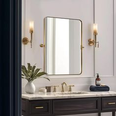 a bathroom vanity with two sinks and a large mirror on the wall above it,